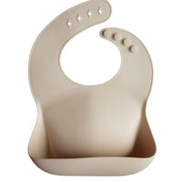 Mushie Silicone Baby Bib, Sand - Hello Little Birdie